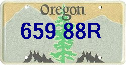 This is the old Orange with black numeral Oregon plate, and it's expired! (2/07)
You made a right exit onto I 29 north from the left lane in front of me, that was real nice of you to do that....of course you dropped the phone when I blew the train horns, almost drove off the ramp into the grass trying to pick your phone.....then you flipped me off with a middle finger salute...how nice. I suppose thatyou told the person you were talking to that this big truck tried to run over me, not mentioning, of course the right exit from the far left lane.... (three westbound lanes)BTW ND state radio was called too. That old Oregon plate really stands out. 